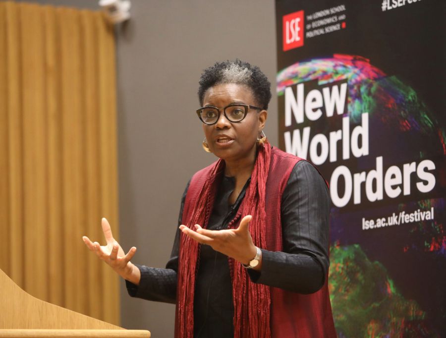 Professor Alcinda Honwana speaking in front of an LSE banner
