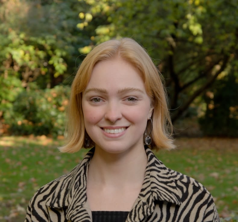 LSE student Destiny Muller smiling in Lincoln's Inn Fields