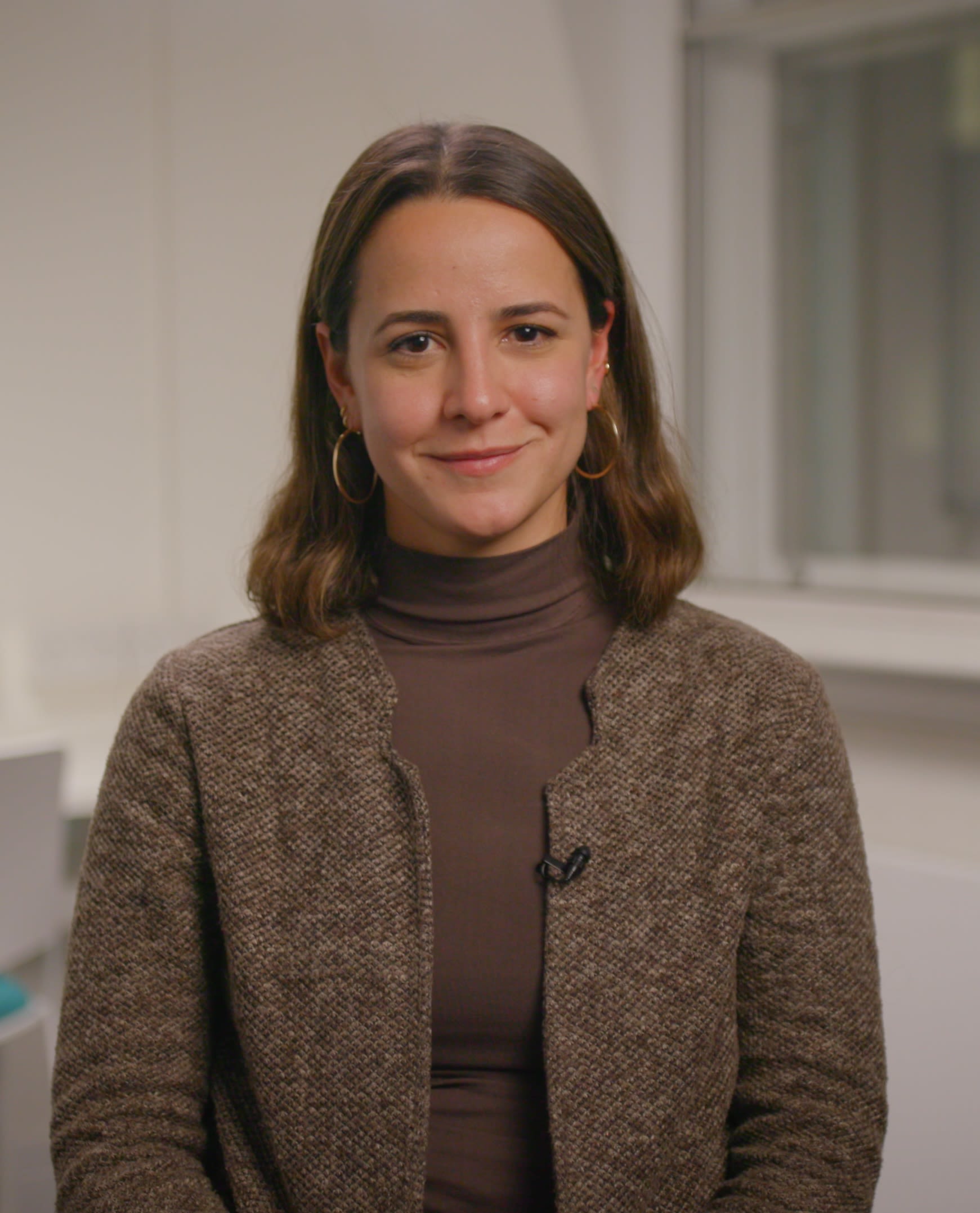 LSE student Rafaela Chiriboga sitting in a classroom and smiling.