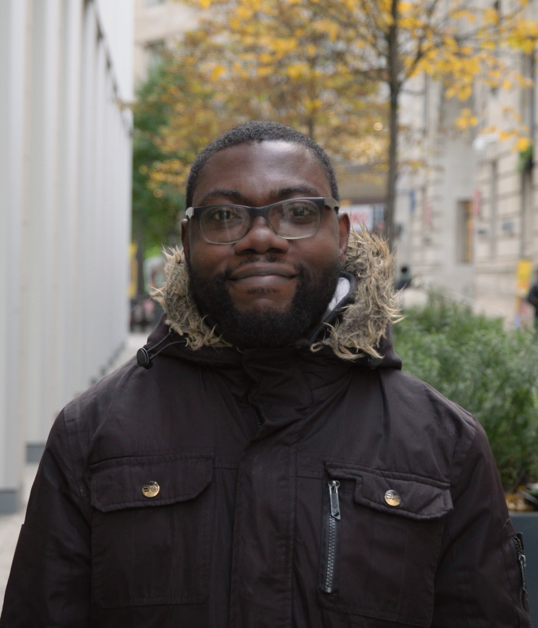 LSE student Jerry Badii standing outside the Marshall Centre and smiling.